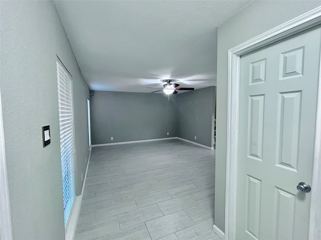 unfurnished room with ceiling fan