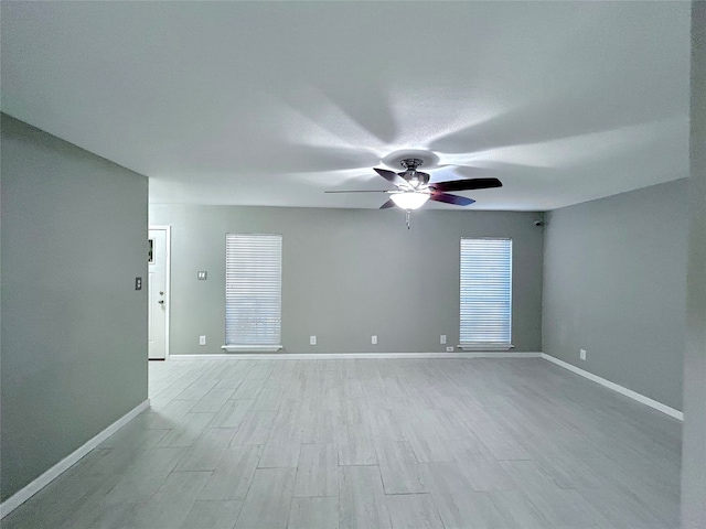 unfurnished room featuring ceiling fan and light hardwood / wood-style flooring