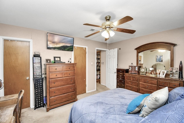 carpeted bedroom with a closet and ceiling fan