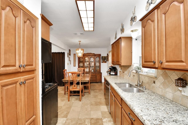 kitchen with pendant lighting, black range, sink, stainless steel dishwasher, and a notable chandelier