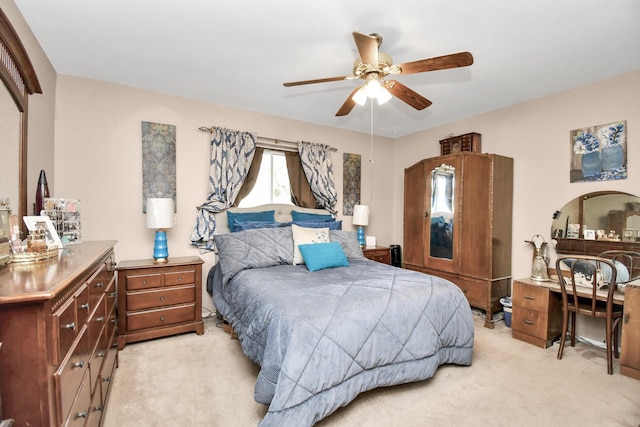 carpeted bedroom featuring ceiling fan