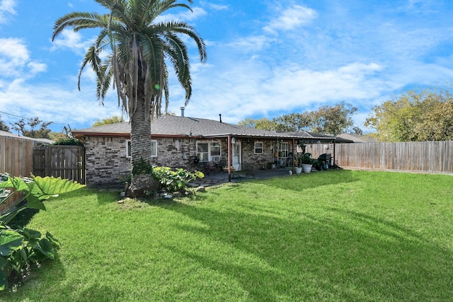 back of house featuring a lawn