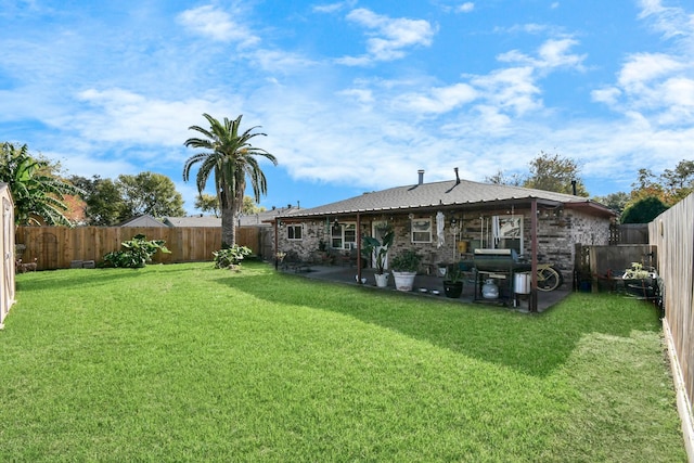 rear view of property with a lawn