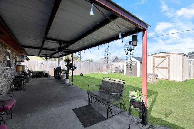 view of patio with area for grilling and a storage shed