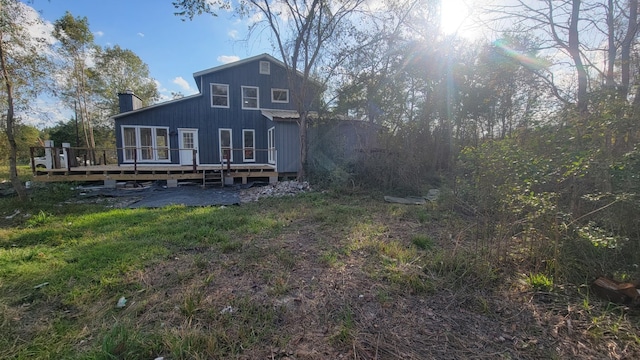 rear view of property with a deck