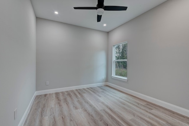 empty room with light hardwood / wood-style floors and ceiling fan