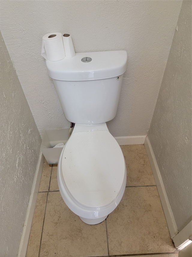 bathroom featuring tile patterned flooring and toilet