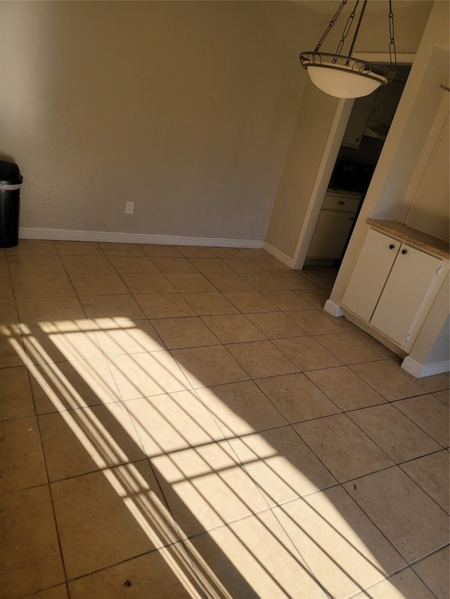 spare room with light tile patterned floors