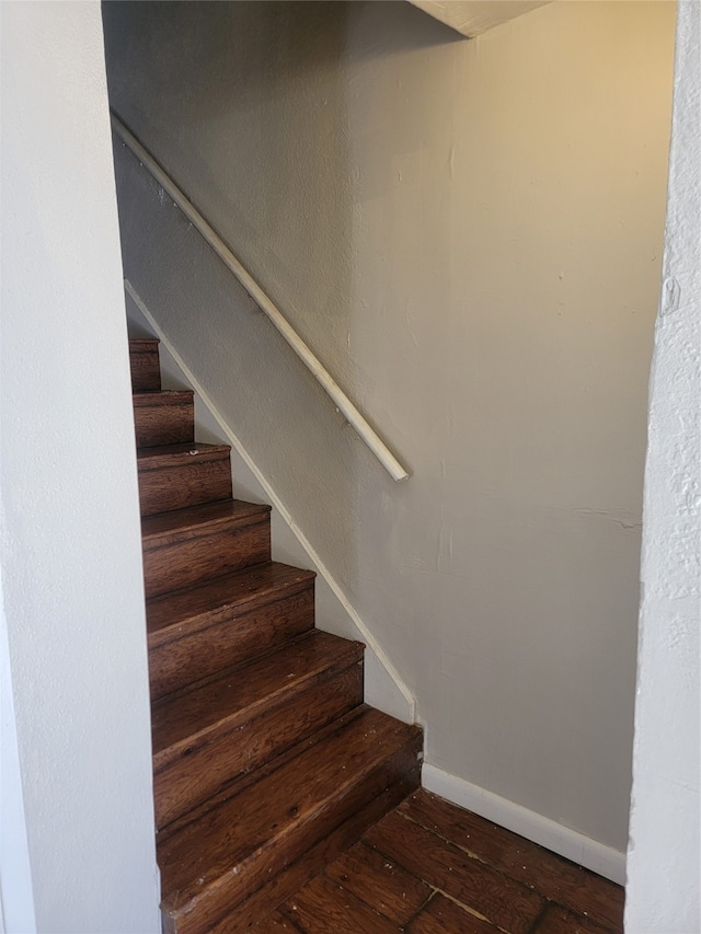 stairs with hardwood / wood-style floors