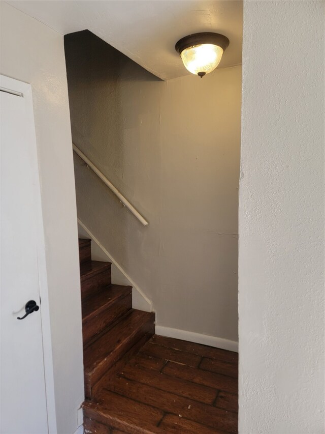 staircase featuring hardwood / wood-style floors