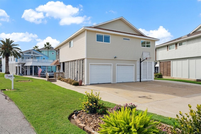 exterior space with a yard and a garage