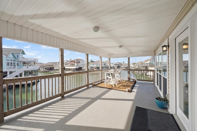 sunroom / solarium with a water view