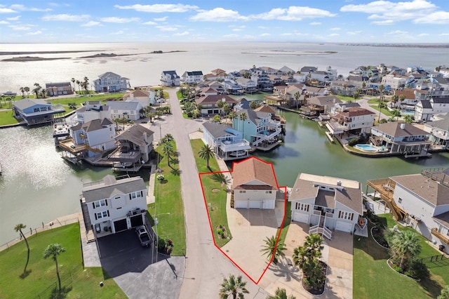 birds eye view of property featuring a water view