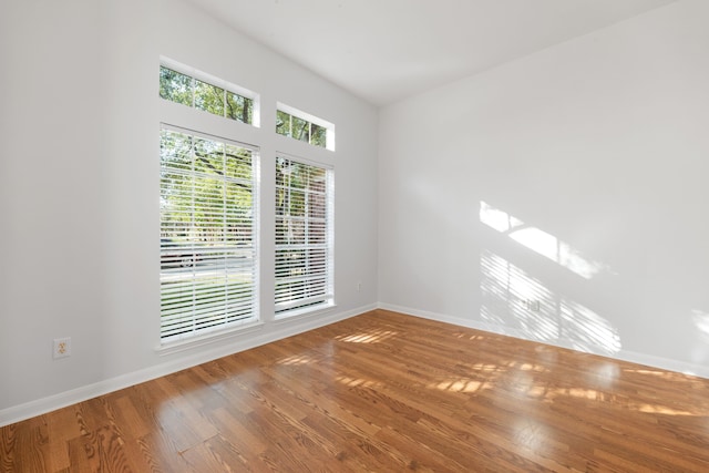 spare room featuring hardwood / wood-style floors