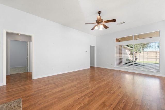 empty room featuring ceiling fan and hardwood / wood-style floors