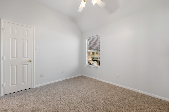 unfurnished room featuring ceiling fan, carpet floors, and lofted ceiling