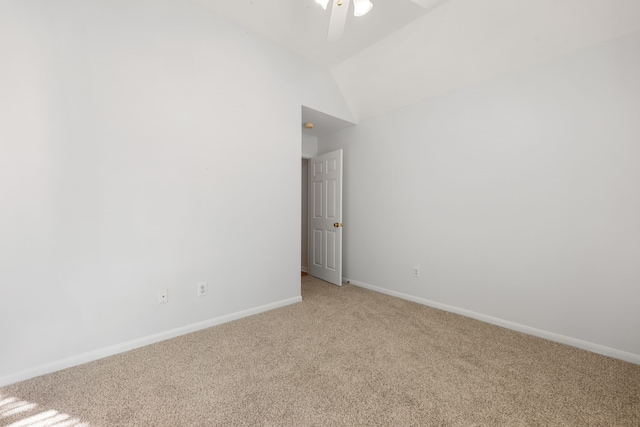 unfurnished room featuring ceiling fan, light colored carpet, and lofted ceiling