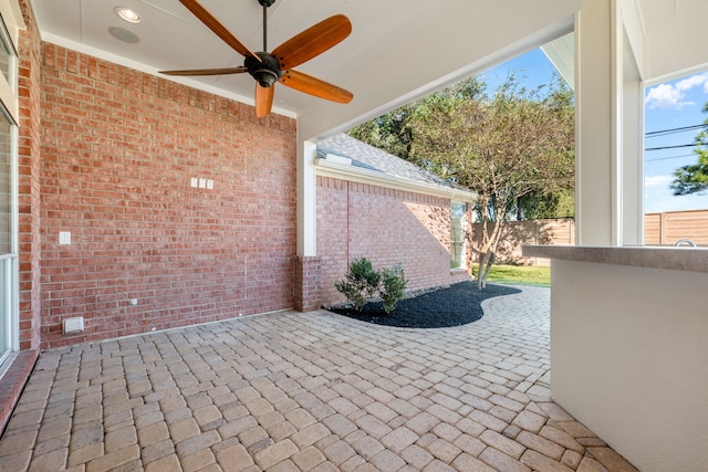 view of patio featuring ceiling fan