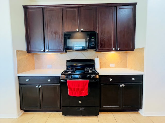 kitchen with black appliances, decorative backsplash, and light tile patterned flooring