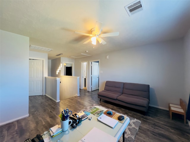 living room with ceiling fan and dark hardwood / wood-style floors