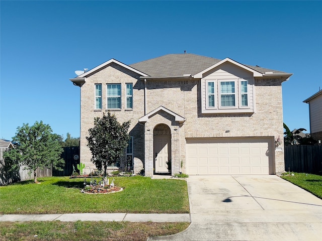 view of front of house featuring a front yard and a garage