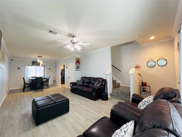 living room featuring ceiling fan with notable chandelier, light hardwood / wood-style floors, and ornamental molding