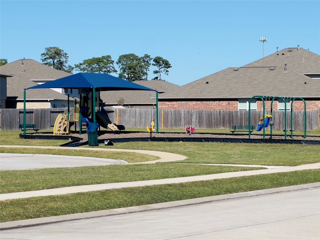 view of playground featuring a lawn