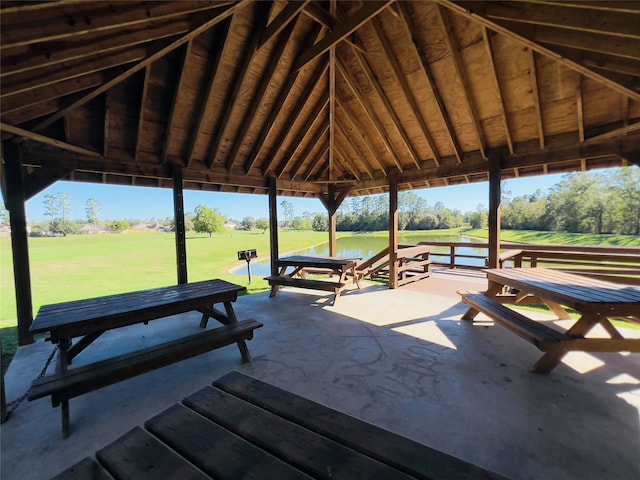 view of home's community featuring a gazebo, a water view, and a yard