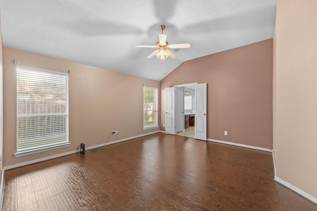 unfurnished room featuring ceiling fan, wood-type flooring, and vaulted ceiling