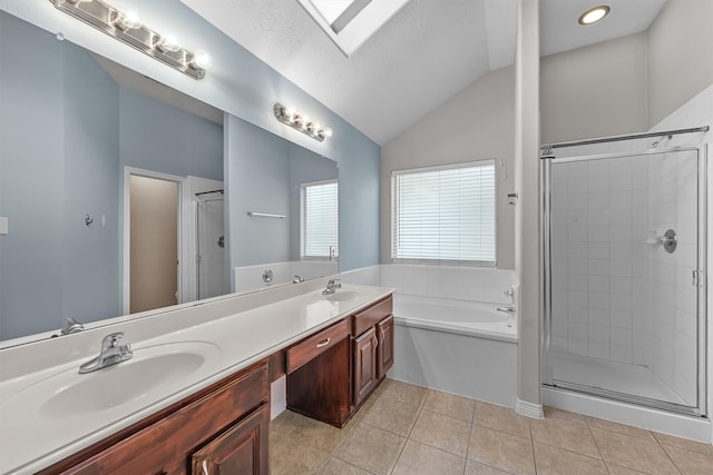 bathroom featuring tile patterned floors, vanity, independent shower and bath, and vaulted ceiling