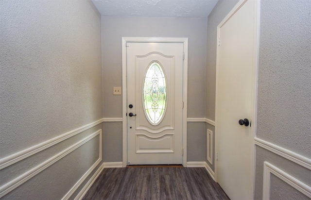 doorway with dark hardwood / wood-style floors