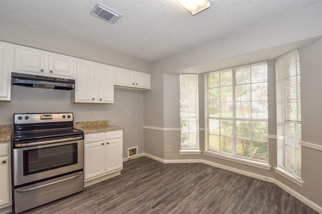 kitchen with light stone countertops, dark hardwood / wood-style flooring, a textured ceiling, stainless steel electric stove, and white cabinetry