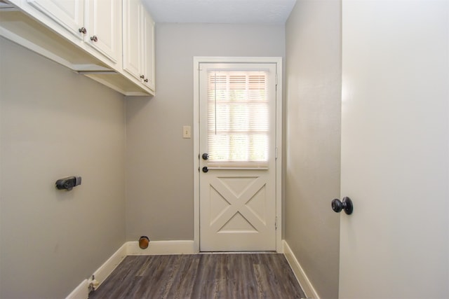 doorway featuring dark wood-type flooring