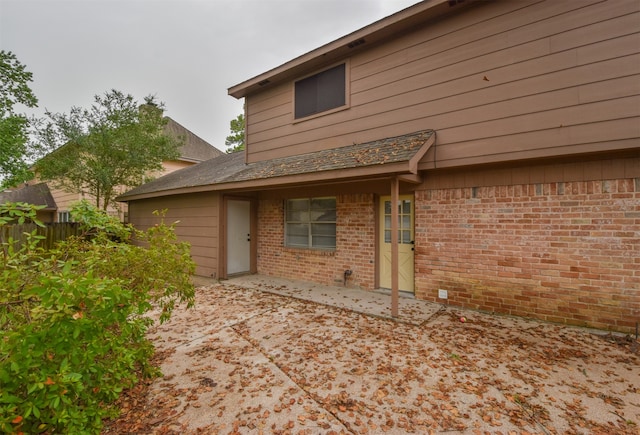 back of property featuring a patio