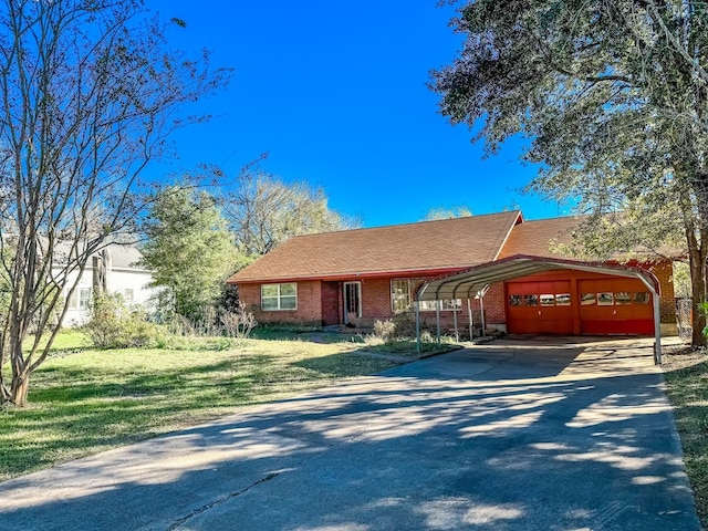 ranch-style house featuring a front lawn and a carport