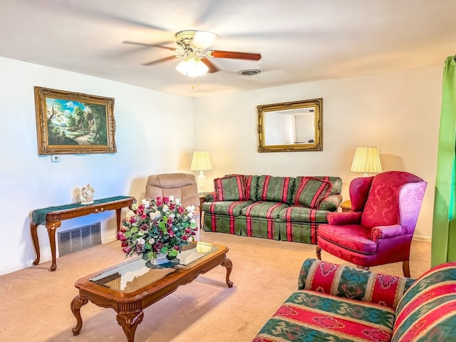 carpeted living room featuring ceiling fan