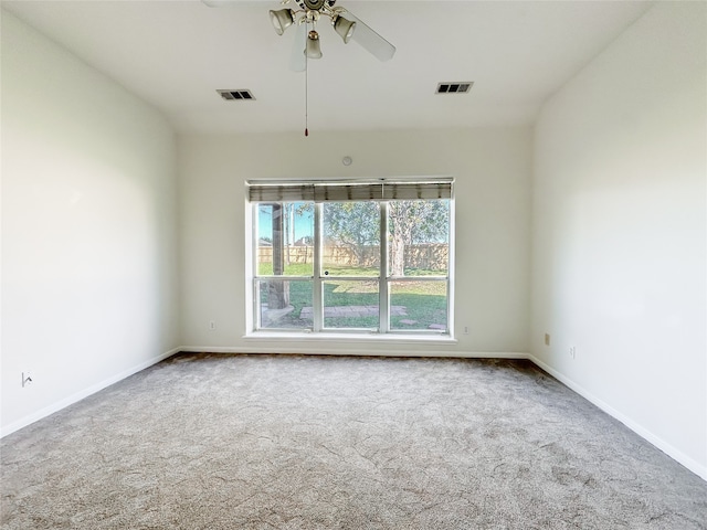 carpeted empty room with ceiling fan and vaulted ceiling