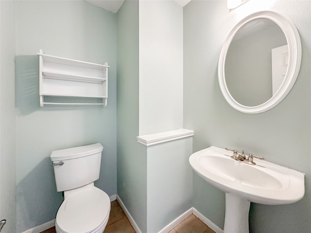 bathroom featuring tile patterned floors and toilet