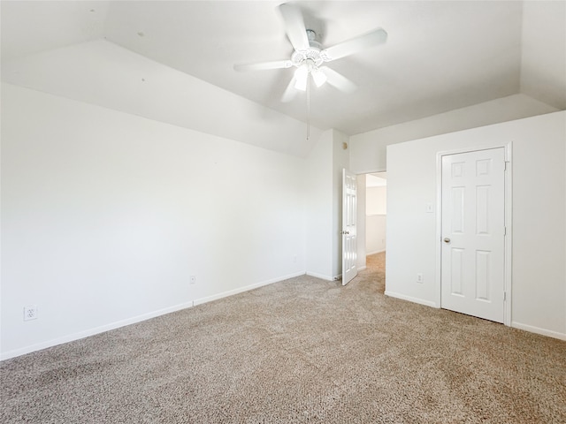 unfurnished bedroom with light carpet, vaulted ceiling, and ceiling fan