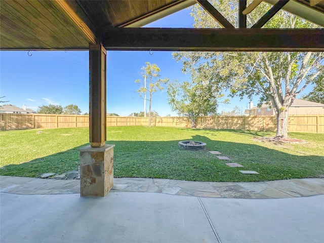 view of yard with a patio and a fire pit