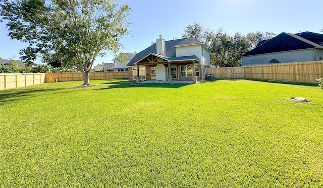 view of yard featuring central AC