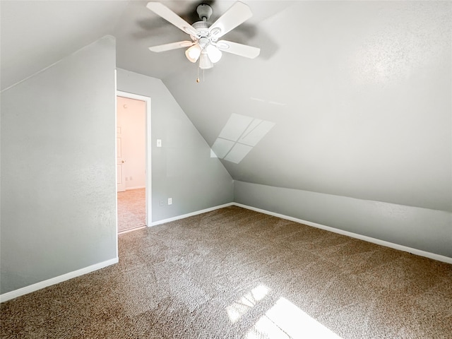 additional living space with carpet floors, vaulted ceiling, and ceiling fan