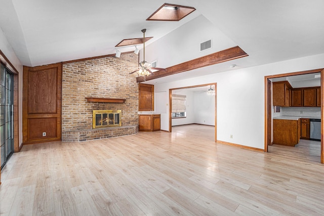 unfurnished living room with a fireplace, vaulted ceiling with beams, light hardwood / wood-style flooring, and ceiling fan