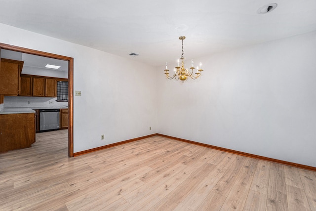 interior space with a notable chandelier and light hardwood / wood-style floors