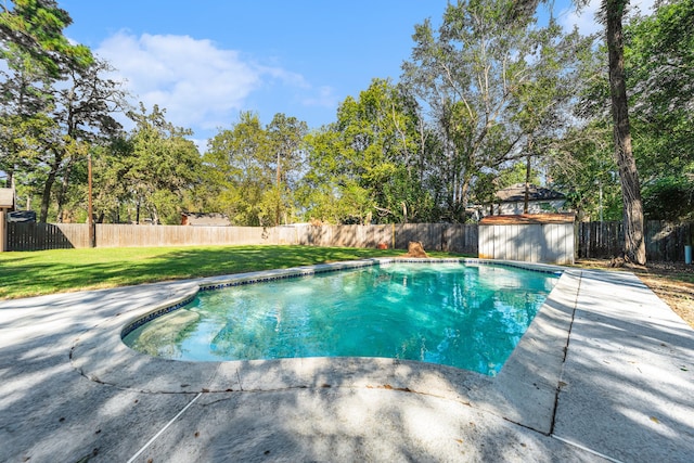 view of swimming pool with a lawn and a patio