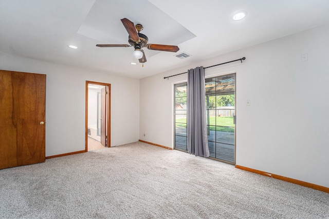 empty room with light colored carpet and ceiling fan