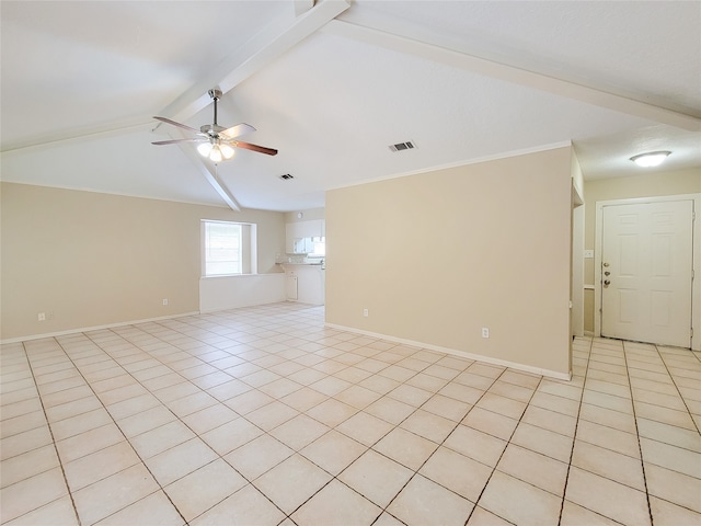 spare room with light tile patterned floors, lofted ceiling with beams, ceiling fan, and crown molding