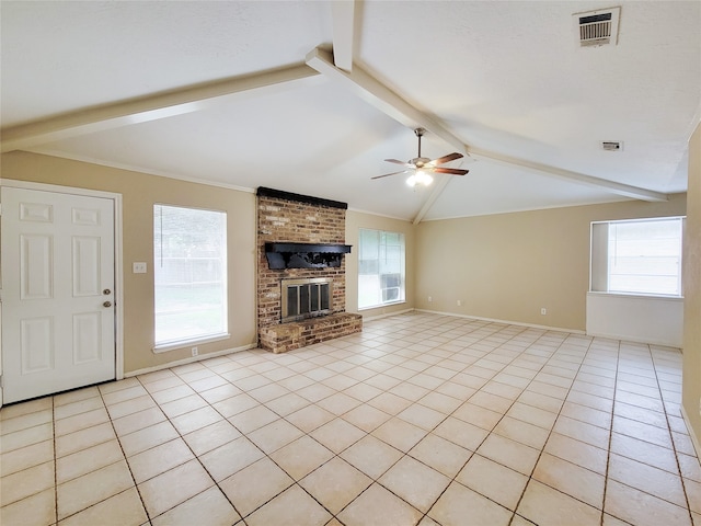 unfurnished living room featuring ceiling fan, vaulted ceiling with beams, a fireplace, light tile patterned floors, and ornamental molding