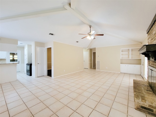 unfurnished living room with vaulted ceiling with beams, ceiling fan, built in features, and light tile patterned floors