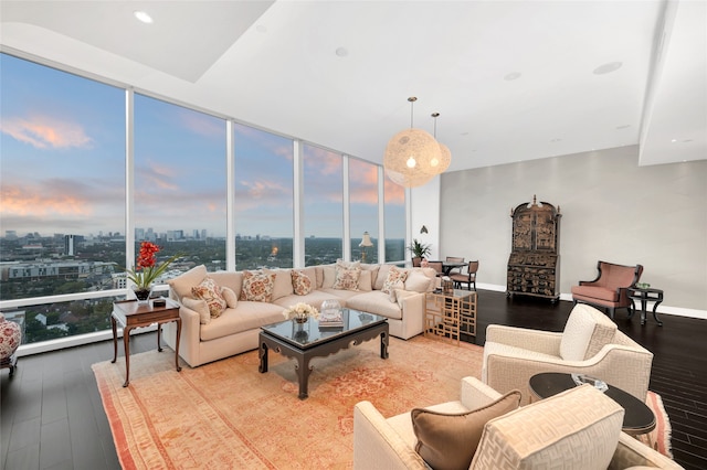 living room with hardwood / wood-style floors and a wall of windows